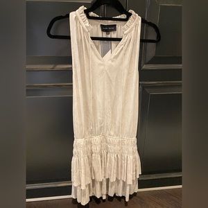 Avery Rayne creme sleeveless split neck ruffle dress